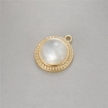 Detailed macro of gold rope-textured pendant with a white pearlescent shell inlay - Round Pendant (P20255)
