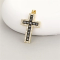 Macro detail of 14K gold cross pendant with black zircon and white pavé setting - Gold Black Zirconia