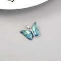 Macro view of blue butterfly pendant with 14K gold flakes and zircon inlay detail - Palladium Black Cyan Gradient Butterfly Style (H-11982)