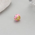 Close-up of 14K gold-plated Evil Eye beads with pink enamel for DIY jewelry making - Pink