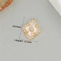 Detailed view of 14K gold floral pendant with white mother-of-pearl and zircon inlays - Cross Petal Mother Of Pearl Zirconia Pendant (WX21781)