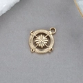 Macro shot of 14K gold plated compass charm featuring N S E W directional engravings - Compass Design Pendant (K-0442)