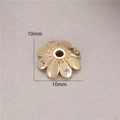 Macro shot of 10mm gold-plated flower bead spacer with micro-inlaid zircons for DIY jewelry - Six-Petal Flower Rhinestone Style (H-8459) / 10mm / Gold