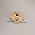 Macro detail of 10.5mm gold flower-shaped spacer bead with embossed texture - Vintage Beaded Edge Style (H-8465)