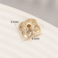 Macro detail of 8.5mm 14K gold-plated flower bead cap with embossed pattern for DIY jewelry - Swastika Relief Style (H-8463)