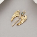 Macro shot of 14K gold plated angel wing pendant with white zircon and green stone - Green Gemstone Angel Wing Pendant (H-8610)