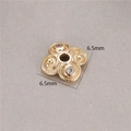 Detailed macro of 14K gold-plated clover spacer bead with 6.5mm size and zircon stones - Vintage Clover Rhinestone (H-8460)