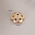 Macro shot of 11mm hollow flower bead cap in 14K gold plated finish for DIY jewelry - Glossy Hollow Petal (H-8461)
