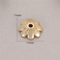 Close-up of 11mm 14K gold plated flower bead cap spacer for DIY jewelry making - Eight Petal Embossed Flower (H-8471)