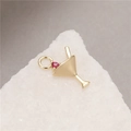 Macro shot of gold martini glass charm with a pink cubic zirconia and jump ring - Martini Glass Shape (H-8658)
