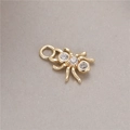 Detailed view of a golden spider pendant with micro-inset zircons and a small hook - Spider Shape (H-8664)