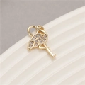 Macro detail of gold flamingo pendant featuring micro-set cubic zirconia crystals - Flamingo Shape (H-8659)