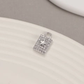 Macro shot of a silver rectangle pendant with micro-set zircon stones and a star motif - Palladium H-9286 Rectangular Star