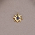 Detailed close-up of 14K gold sun pendant featuring a central blue gemstone and colored zircons - Sun Flower Blue Gemstone Pendant (H-8787)