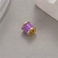 Close-up of a purple enamel waist-drum bead with gold metal edges for DIY jewelry making - Purple