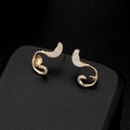 Macro shot of gold-plated swirl earrings featuring shimmering white zircon micro-inlay - Streamlined Vortex Style (H-6270) / Gold