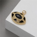 Macro detail of 14K gold marquise evil eye pendant with black inlay and geometric texture - 14K Gold Marquise Shape (H-7744)