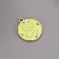 Detail of round green enamel coin pendant with golden snake motif and zircon accents - Yellow