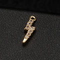 14k gold lightning bolt pendant with sparkling white zircons on black leather background - White Zirconia Lightning Shape (H-6662)
