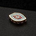 Ethnic gold evil eye charm with blue and red zircons and side heart cutouts - Olivary Colored Rhinestone (H-6683)