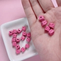 7mm pink cheese cube dice beads for DIY jewelry making displayed on a small white plate - Rose Red