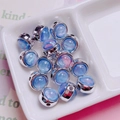 Macro detail of acrylic star charms with silver edges for DIY jewelry making - Round / Blue