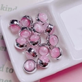 Detailed view of pink cat eye beads with silver metal base for DIY jewelry making - Round / Pink