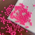 Vibrant bright pink acrylic cube spacer beads scattered on wooden table for DIY crafts - Approx. 150 Pcs (5mm, 3mm Hole) / Rose Red