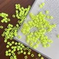 Macro shot of bright yellow square acrylic beads with large holes on a wooden desk - Approx. 150 Pcs (5mm, 3mm Hole) / Yellow
