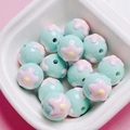 Detailed view of mint green floral beads with hand-painted heart patterns for DIY crafts - Size Approx 16mm Hole Approx 2.2mm / 01-Cyan