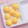 Macro detail of yellow acrylic pineapple beads for DIY jewelry with vertical hole - Size Approx 17mm Hole Approx 2.5mm / Yellow