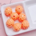 Close-up of orange acrylic pineapple beads with geometric facets for DIY jewelry making - Size Approx 17mm Hole Approx 2.5mm / Orange