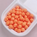 Macro view of 10mm bright orange lacquered acrylic beads for DIY jewelry making and crafts - 10mm / Orange