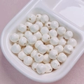 Close-up of 10mm glossy ivory acrylic beads for DIY jewelry and phone chain making - 10mm / Off White