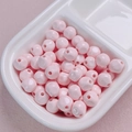 Macro detail of 10mm glossy pink acrylic beads with center hole for DIY jewelry making - 10mm / Light Pink