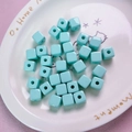 Macro shot of 12mm mint green acrylic square spacer beads for DIY jewelry making - 12mm / Cyan