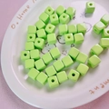 Close-up of 12mm lime green acrylic cube beads with holes for DIY jewelry making - 12mm / Fruit Green