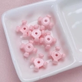 Detailed macro view of pink acrylic macaron flower beads for DIY phone chains and jewelry - 10x15mm / Light Pink