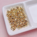 Accessori per gioielli fai-da-te con perline in acrilico dorato e fori passanti - 6mm / Oro