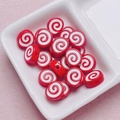 Macro shot of red and white spiral acrylic beads in a ceramic tray for DIY jewelry projects - Size Approx 10x12mm Hole Approx 2mm / Red