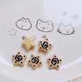 Five beige acrylic star beads with black spiral patterns for DIY phone chains and jewelry - Brown