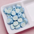 Detail of light blue swiss roll acrylic beads with swirl texture for DIY jewelry making - Size Approx 10x12mm Hole Approx 2mm / Light Blue