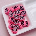 Macro shot of pink and black spiral acrylic beads for DIY jewelry making in a ceramic tray - Size Approx 10x12mm Hole Approx 2mm / Rose Red
