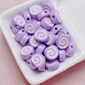 Macro shot of purple swirl acrylic Swiss roll beads for DIY jewelry and phone charms - Size Approx 10x12mm Hole Approx 2mm / Purple