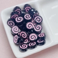 Close-up of black acrylic beads with pink spiral pattern for DIY jewelry crafts - Size Approx 10x12mm Hole Approx 2mm / Black