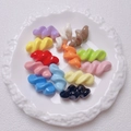 Close-up of colorful acrylic spiral twist beads for DIY jewelry making in a ceramic plate - 27.5x14mm / Random Mixed Colors