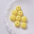 Macro shot of bright yellow pumpkin-shaped acrylic beads for DIY jewelry making and crafts - Size approx 14.5*15.5mm, aperture approx 3.5mm (Single Piece) / Yellow