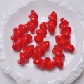 Vibrant red spiral acrylic beads for DIY jewelry making displayed on a white plate - 27.5x14mm / Red