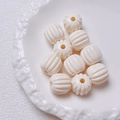 Macro shot of cream white pumpkin-shaped acrylic beads with vertical grooves for DIY jewelry - Size approx 14.5*15.5mm, aperture approx 3.5mm (Single Piece) / Off White