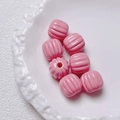 Macro shot of pink acrylic pumpkin beads with ribbed texture for DIY jewelry making accessories - Size approx 14.5*15.5mm, aperture approx 3.5mm (Single Piece) / Pink